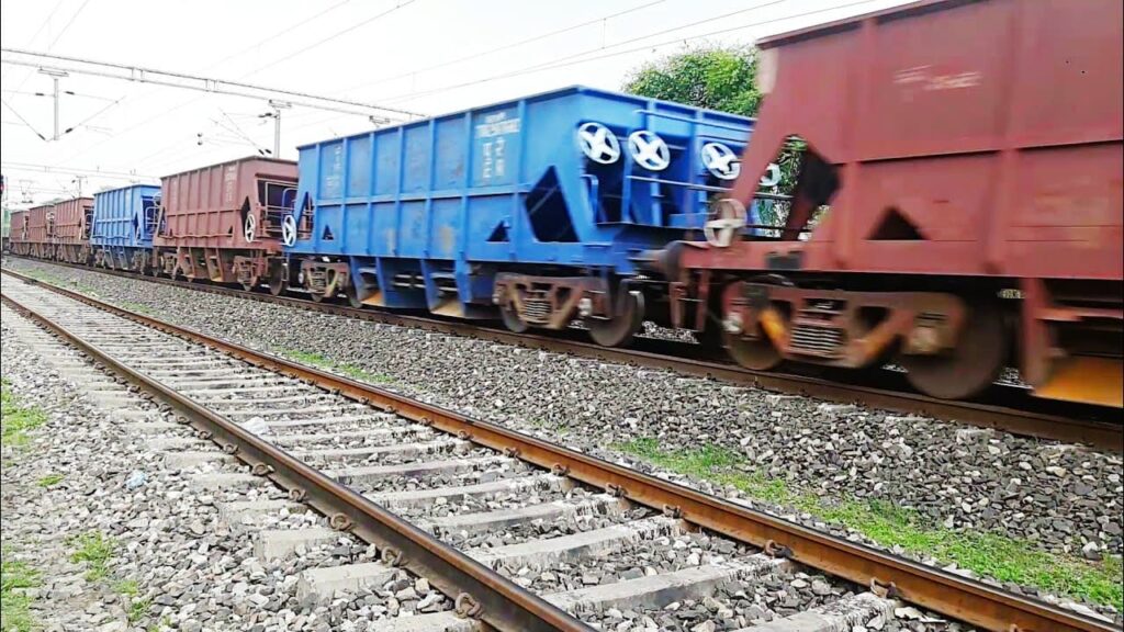 Indian Railways freight train with mixed BOXN and BOBRN wagons carrying coal on electrified track