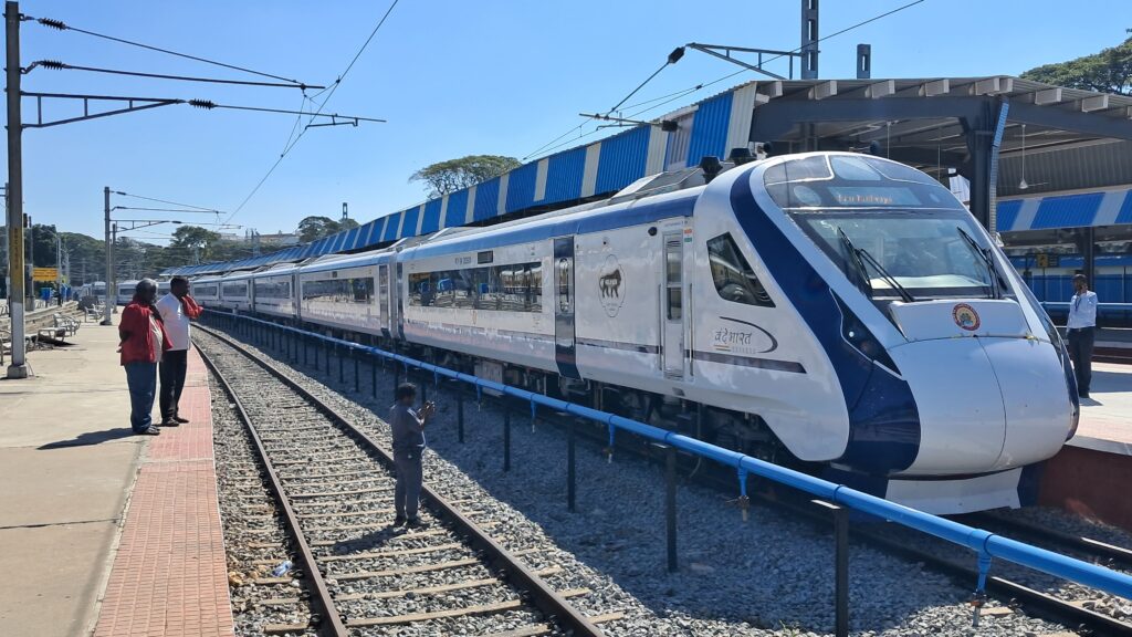 Vande Bharat Express at railway station platform showing modern high-speed train with high ticket demand in India
