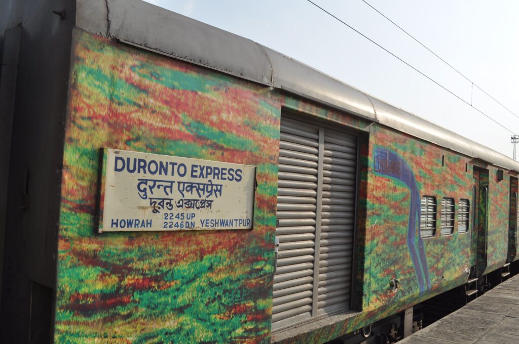 Duronto Express train coach with Howrah to Yesvantpur route signboard on Indian Railways