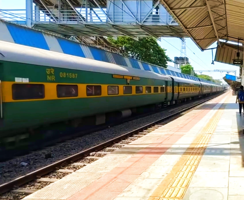 Indian Railways passenger train with LHB coaches passing through station platform