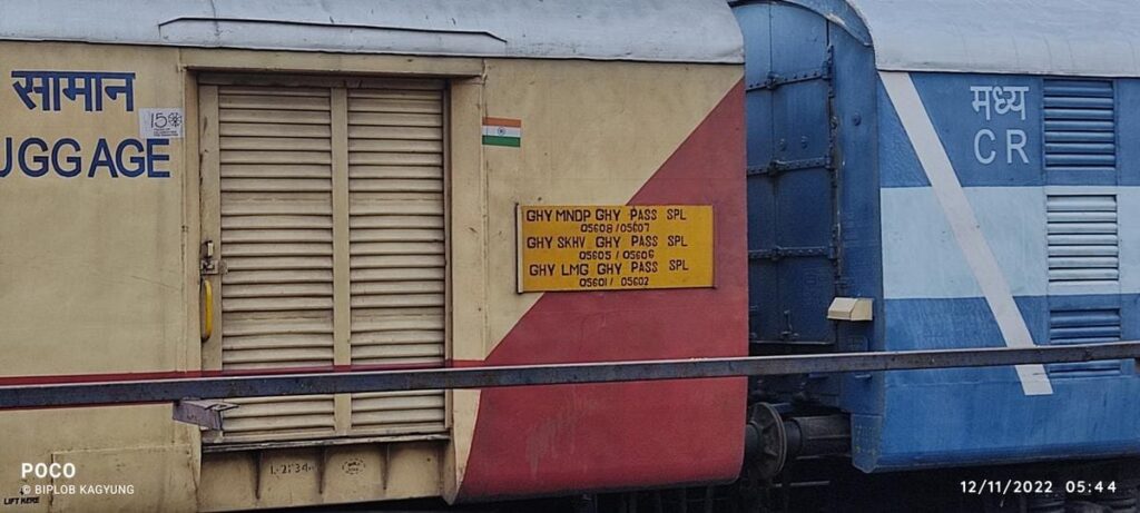 Indian Railways luggage coach with passenger train route board showing slow passenger services