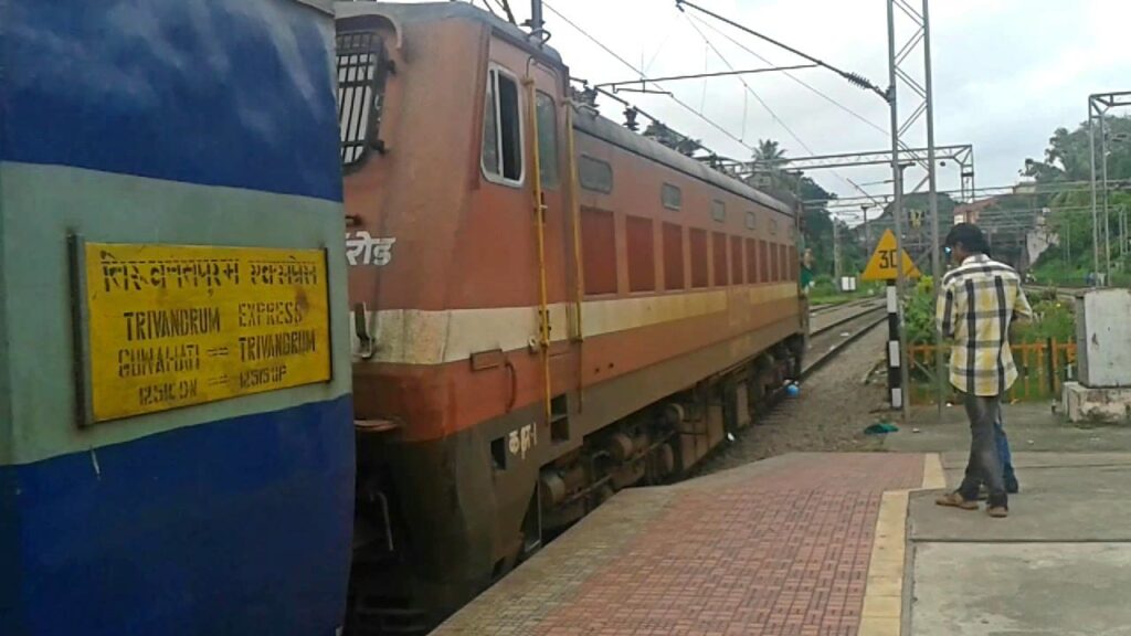 Guwahati to Trivandrum Express train at station platform with locomotive and route board visible