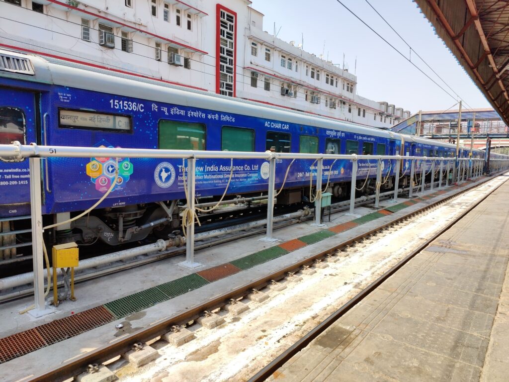 Tejas Express train coach at railway station platform showcasing modern Indian Railways premium train