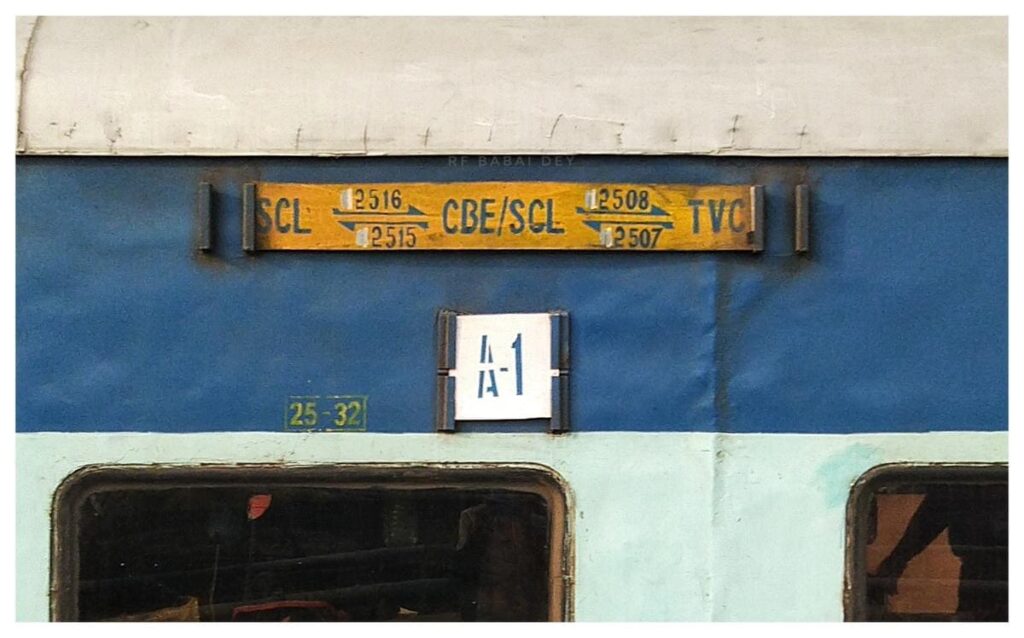 Indian Railways coach route board Silchar to Coimbatore train signage on blue coach