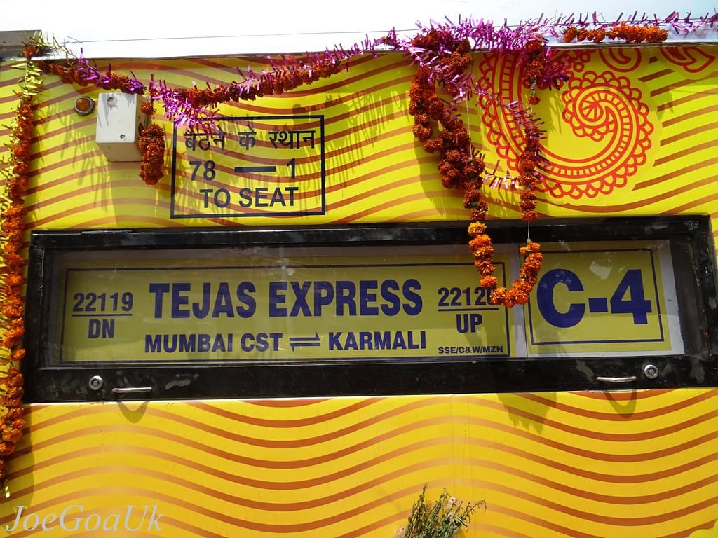 Tejas Express coach board showing Mumbai CST to Karmali route with decorated exterior design