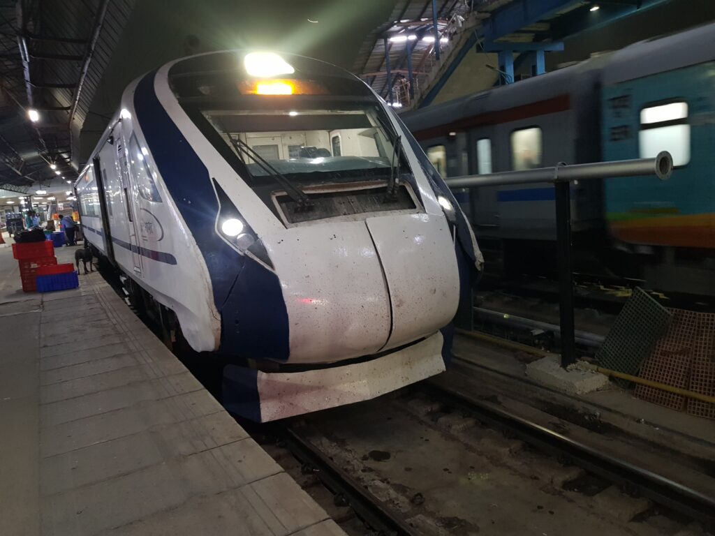 Vande Bharat Express train standing at railway platform in India at night