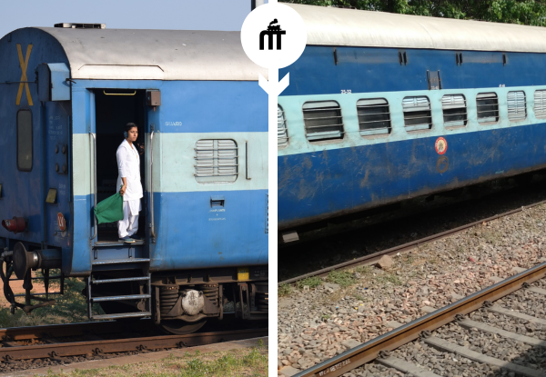 Indian Railways blue sleeper coach with passenger standing at train door on railway track